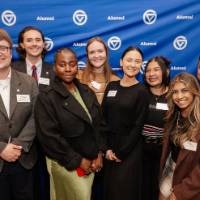 Young Alumni Council member smile together